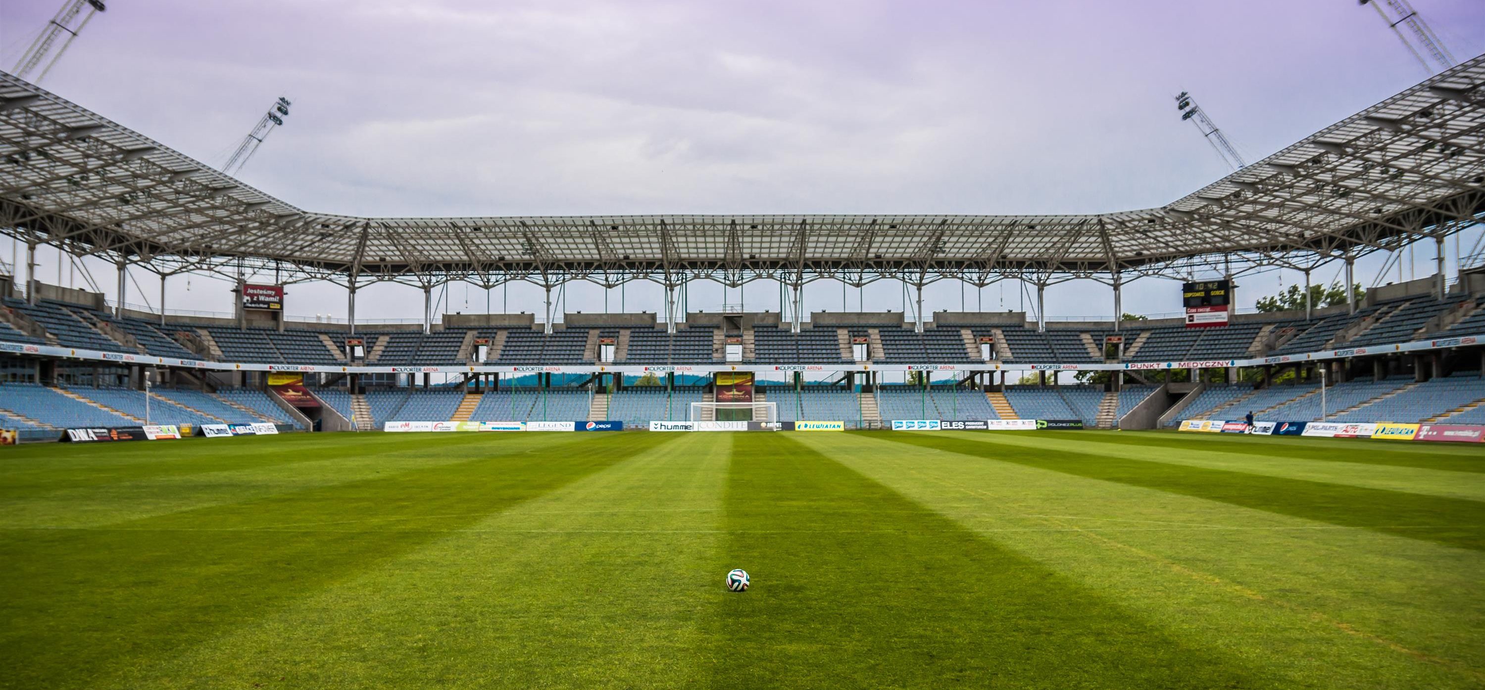 Soccer Ball on field with the goal in the distance